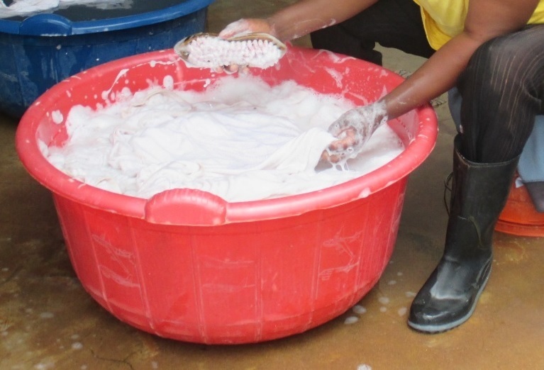 Washing bed sheets by hand