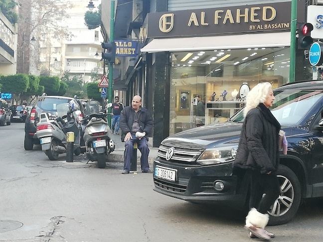 motorcycles and cars blocking pedestrian crossing