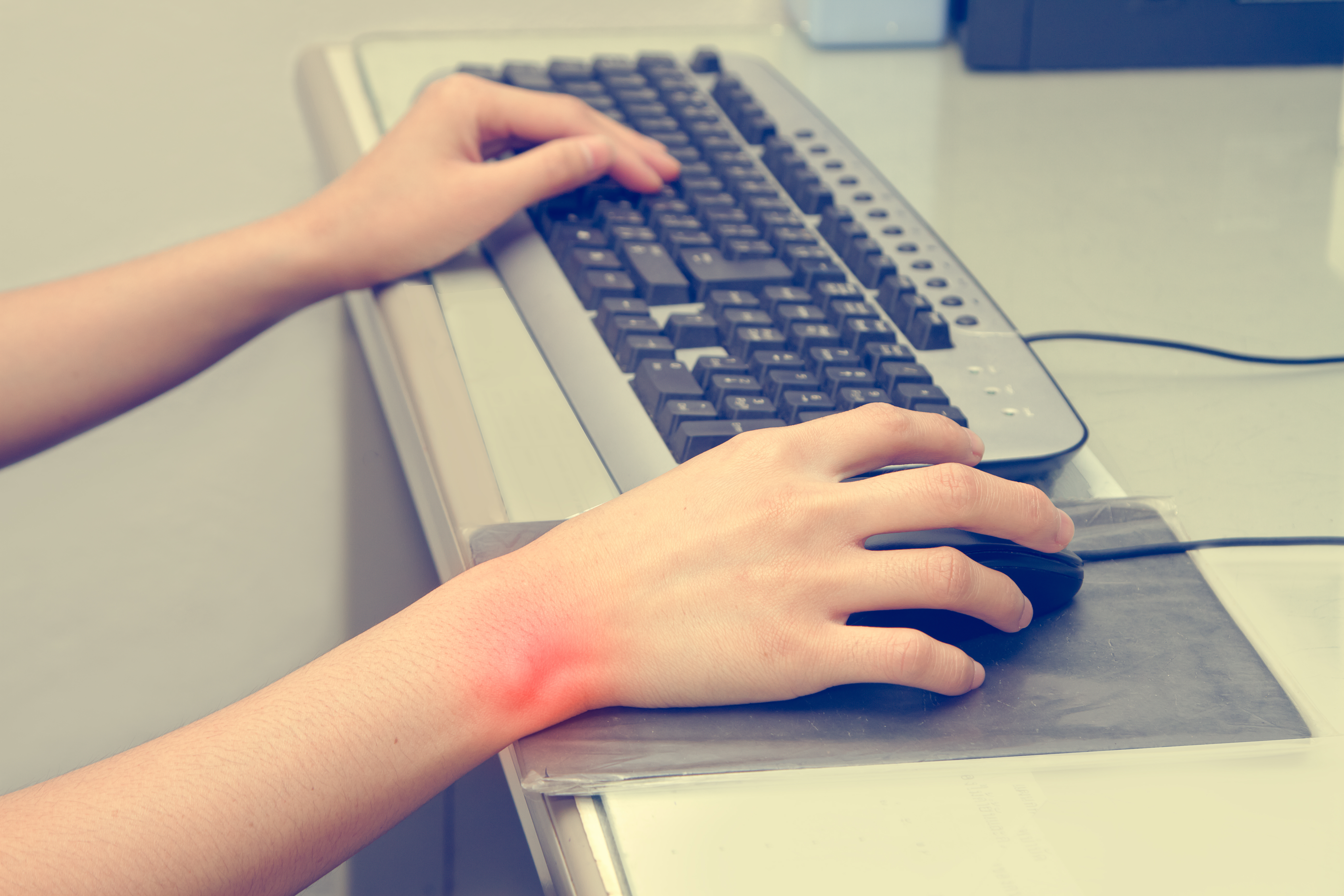 Two hands and a keyboard. Wrist pain in the right hand _COLOURBOX11400919.jpg