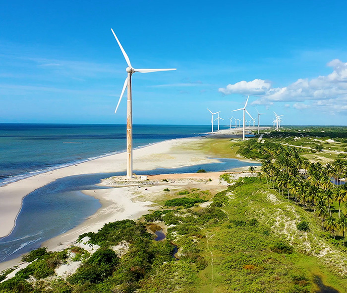 A coastal windfarm in a tropical area.
