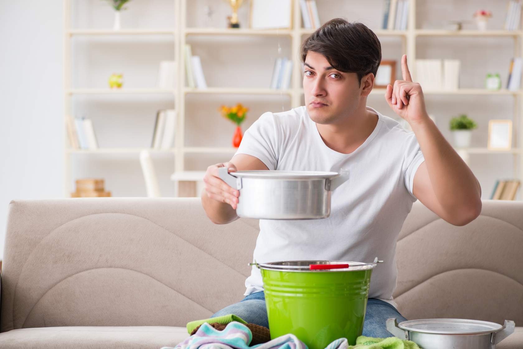 Man points finger up to indicate solution is at hand