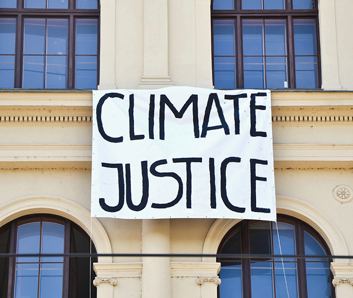 Protest sign saying "Climate justice".