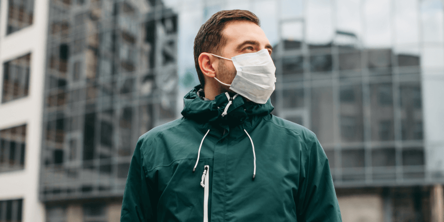 Man wearing a face mask to help protect from COVID-19