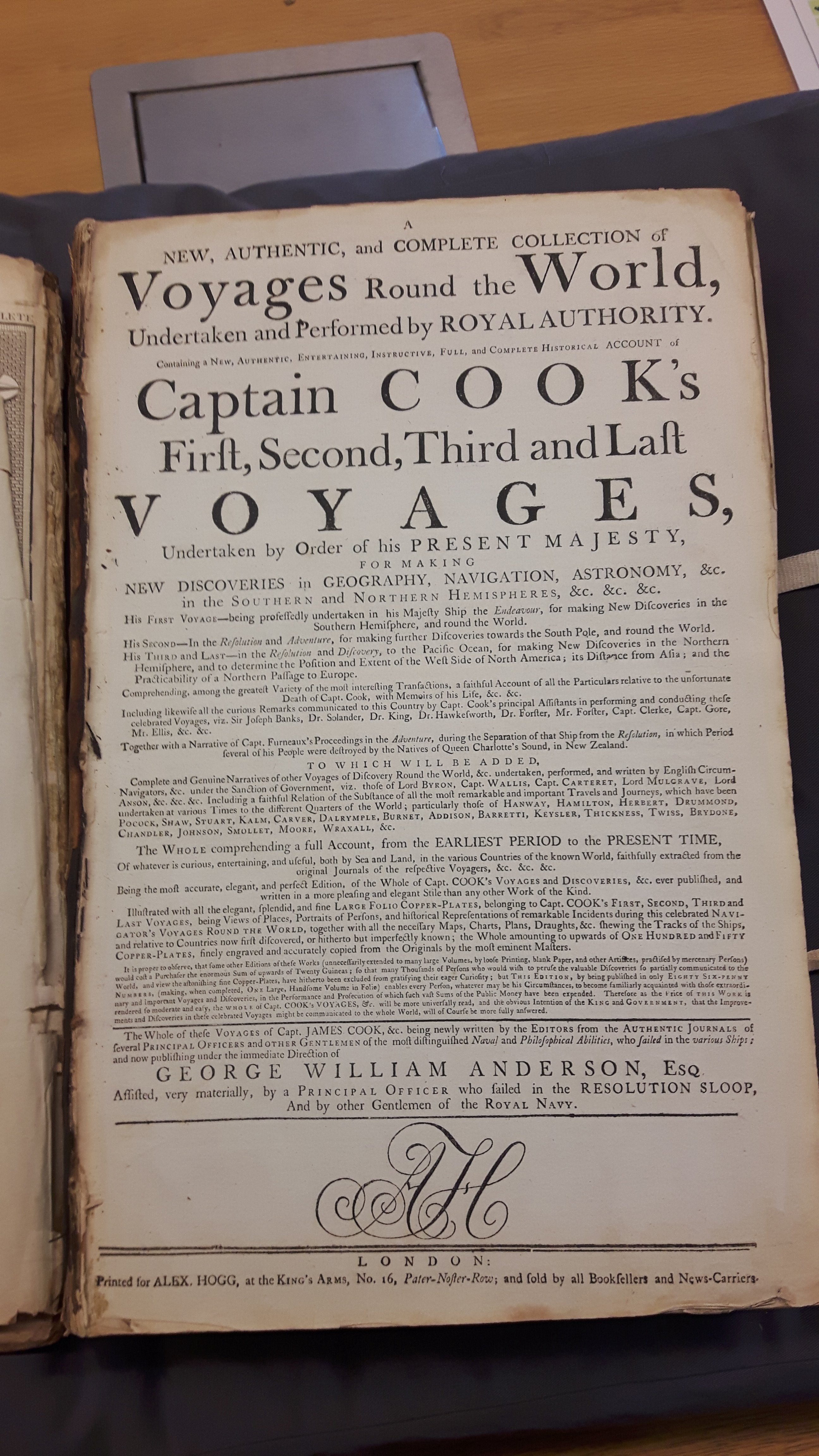 printed front page saying new and complete collection of voyages around the world undertaken and performed by royal authority, Captain Cook's first, second, third and last voyages undertaken by order of his present majesty