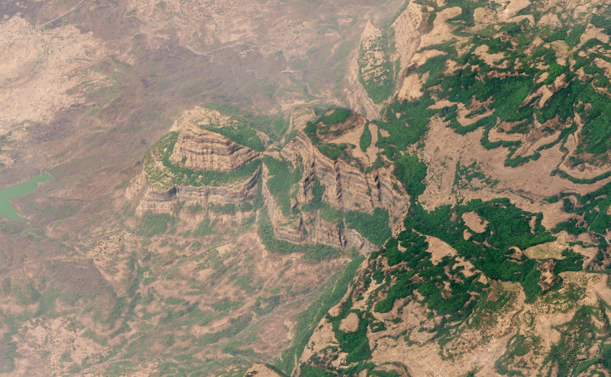 Optional image title Aerial shot showing the rugged mountains and unusual landscape of the Deccan Traps in Maharashtra, India