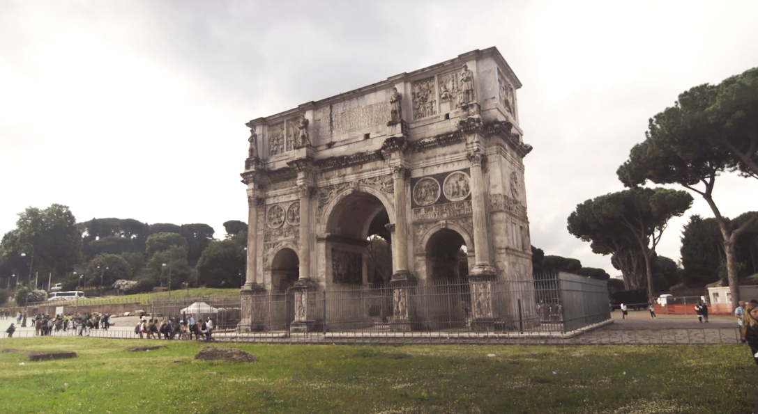 A large stone arch with carved images