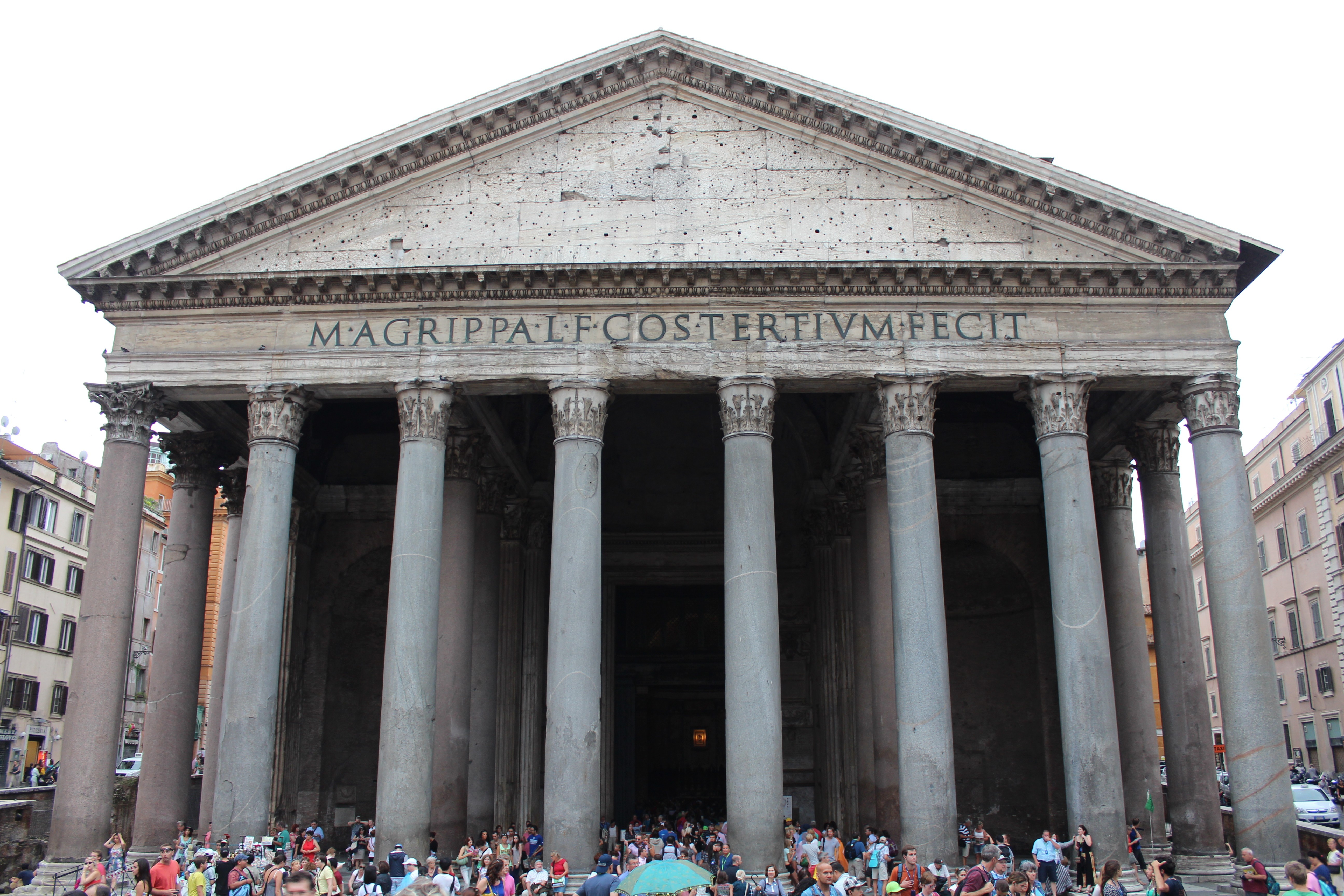 A photo of the front of a large Roman temple with huge marble columns