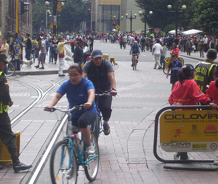 Cyclists and pedestrians on the road with no cars in Bogotá, Colombia.