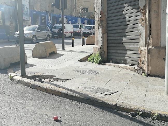 concrete barriers and uneven pavement