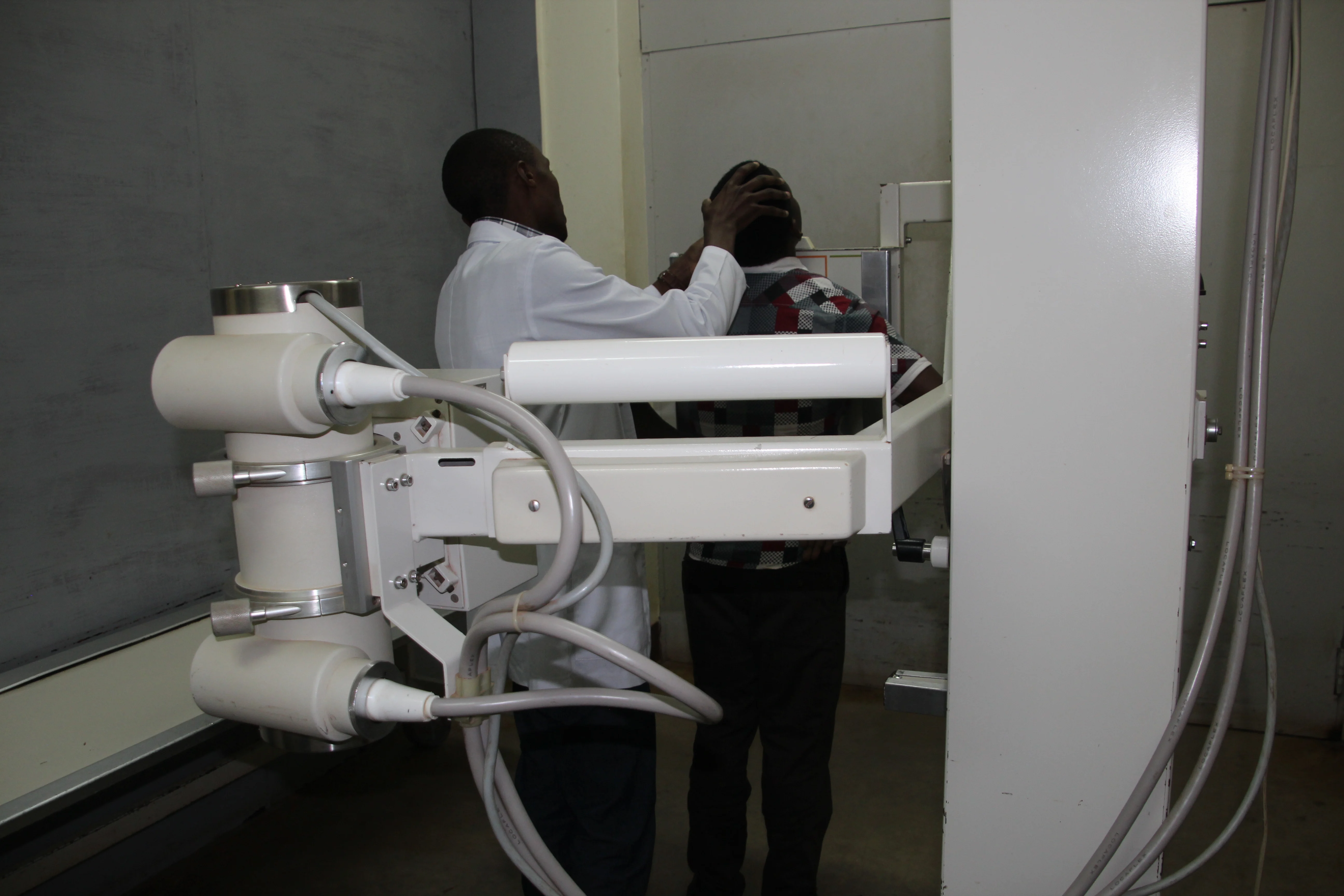 Doctor prepairing patient for taking x-ray picture