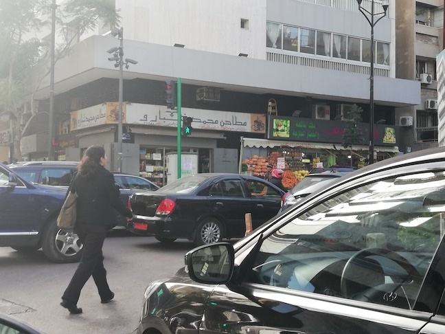 motorcycles and cars blocking pedestrian crossing