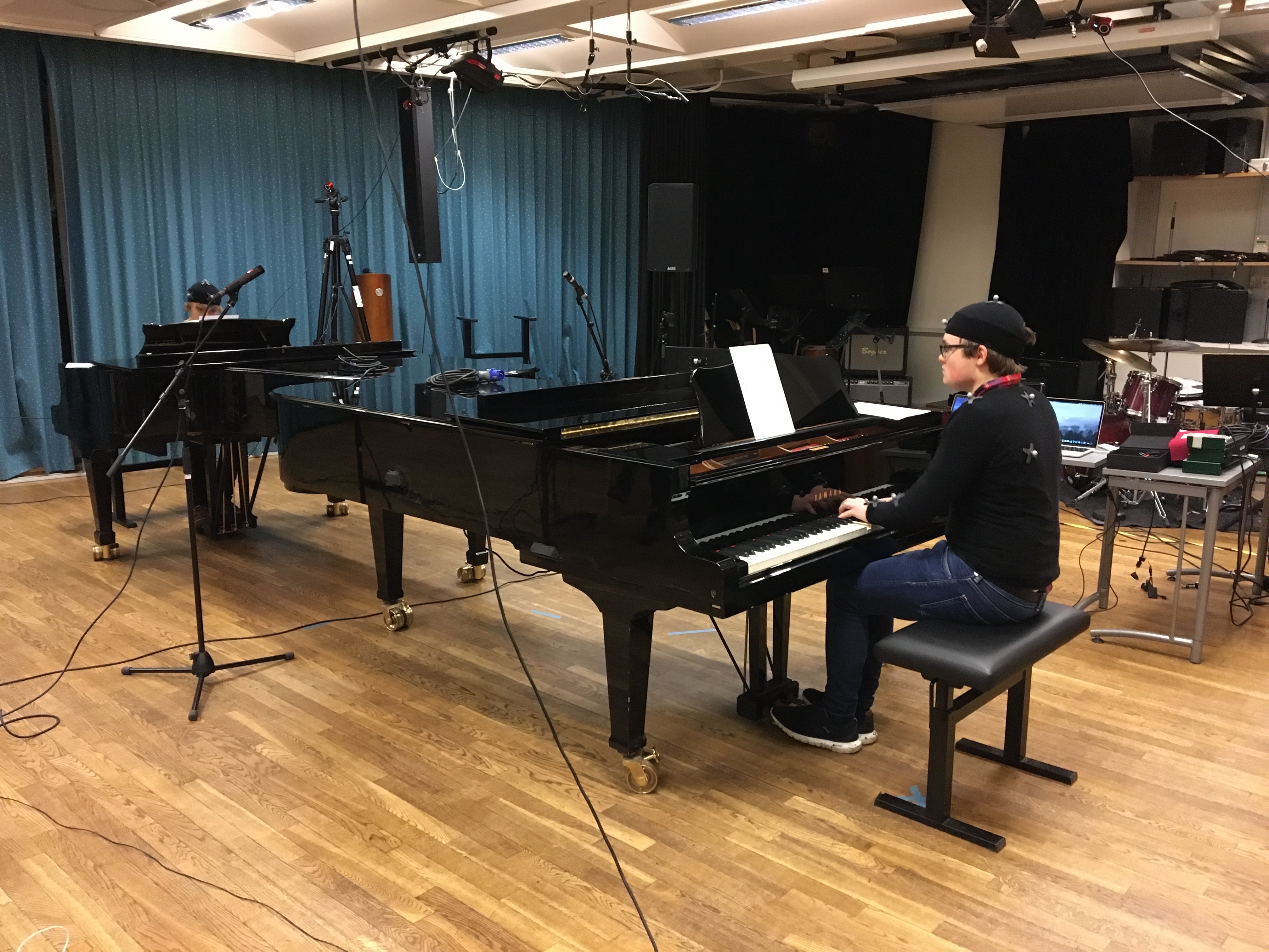 Piano duo performing.