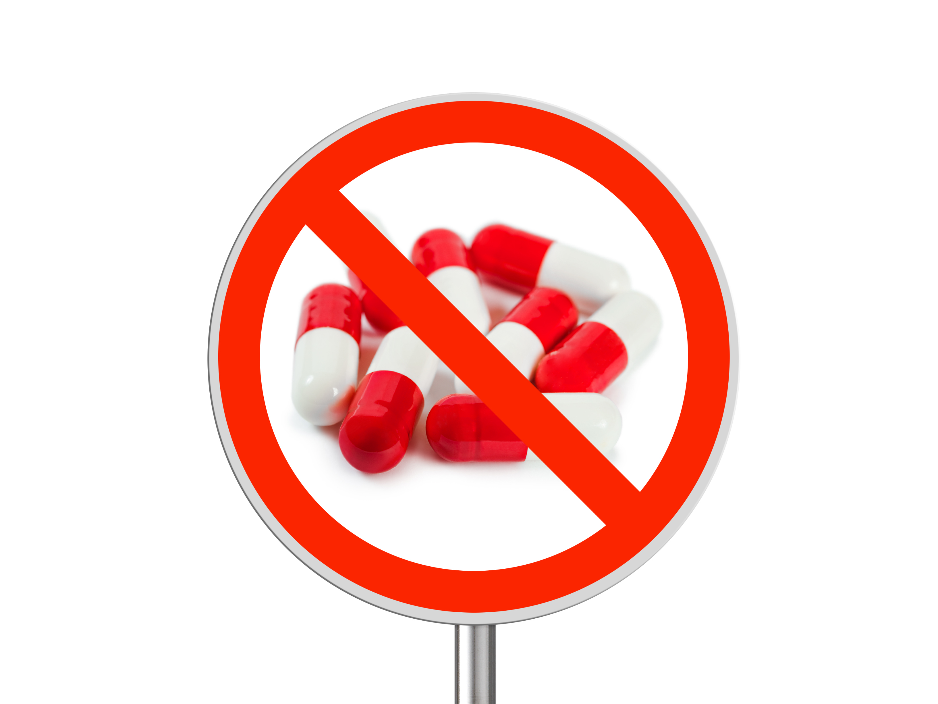 Pills with a warning sign 