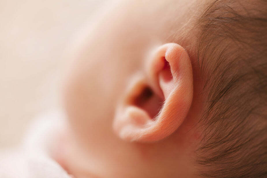 Close-up image of baby's left ear.
