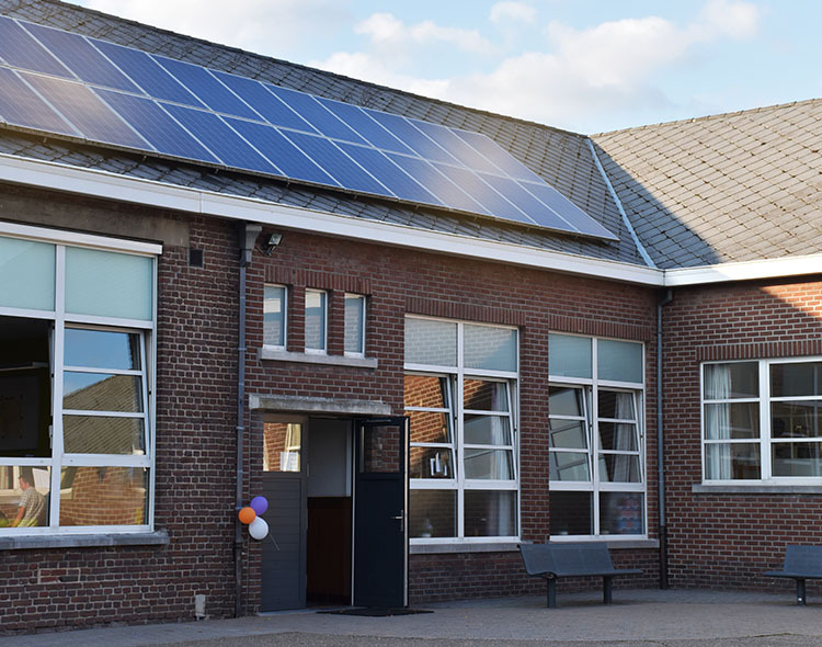 School with solar panels on the roof.