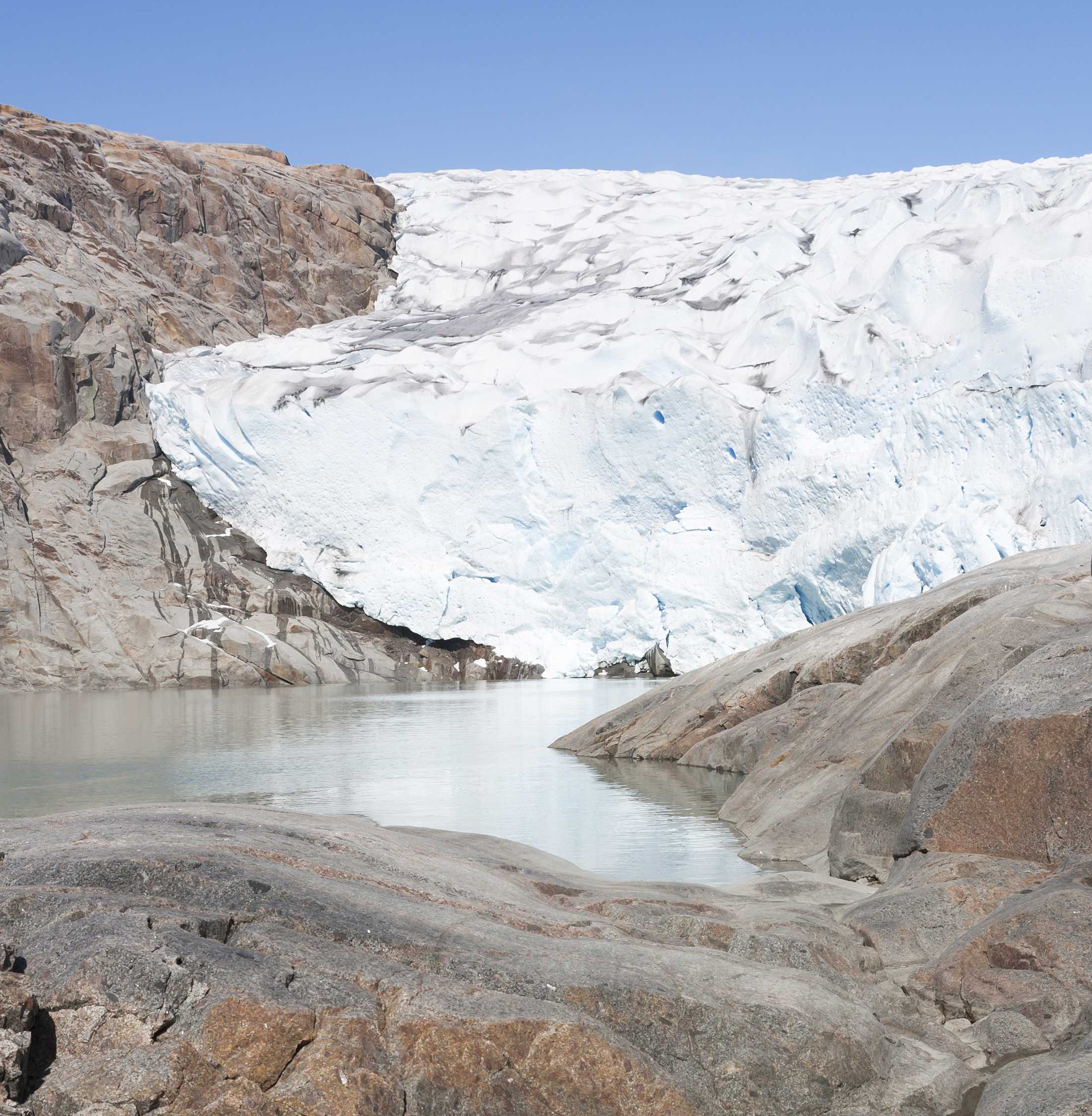 Wall of ice and rocky coast