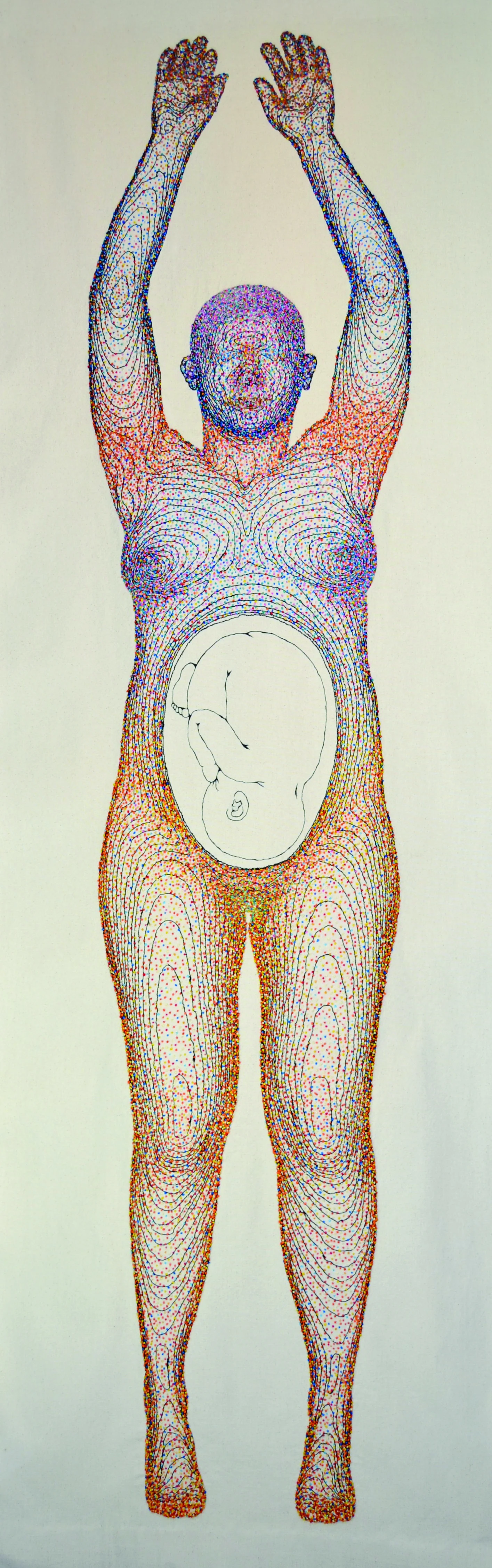 Outline of a human body using embroidered textile. Within the outline there are many different colored dots which are hand-embroidered French knots. The body also has the outline of an unborn child within