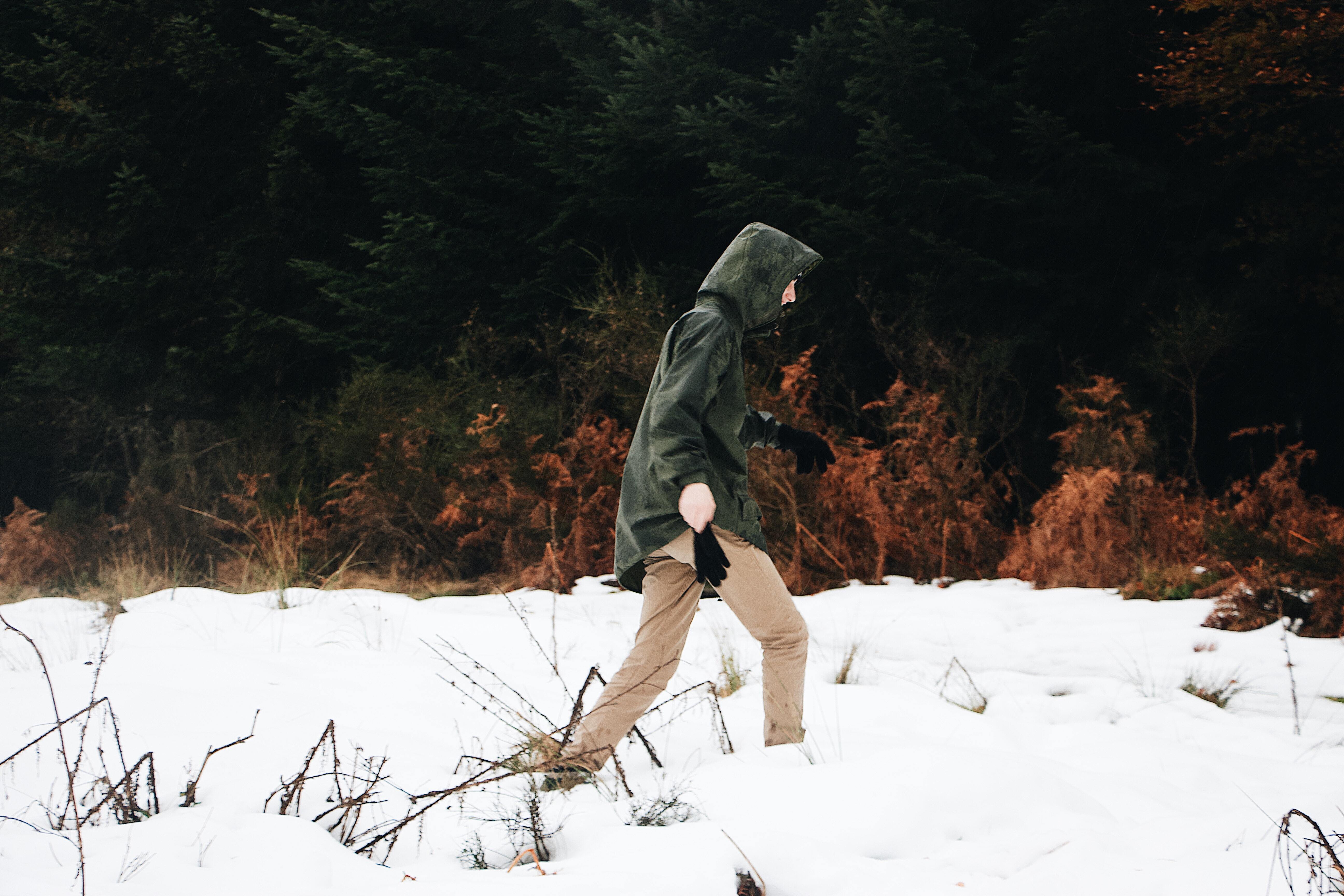 man walking in snow