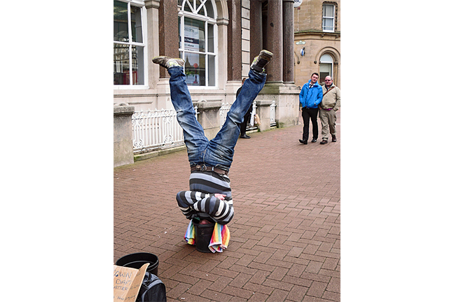 Man standing on head