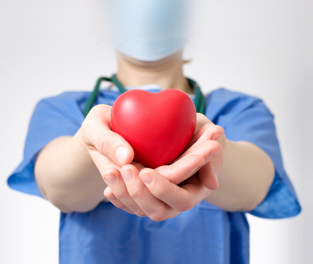 Person holding a toy heart