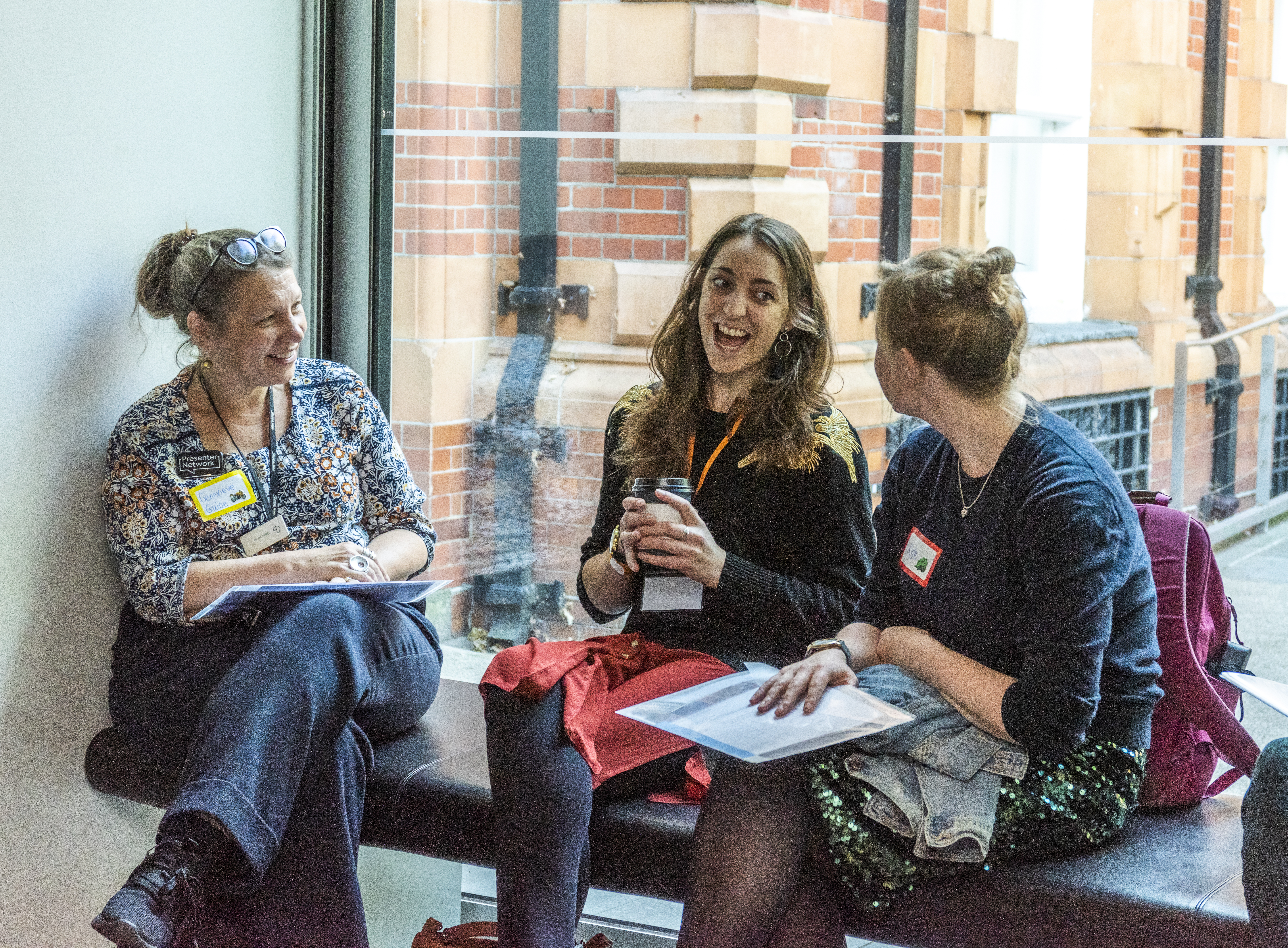 Presenters chatting at a conference