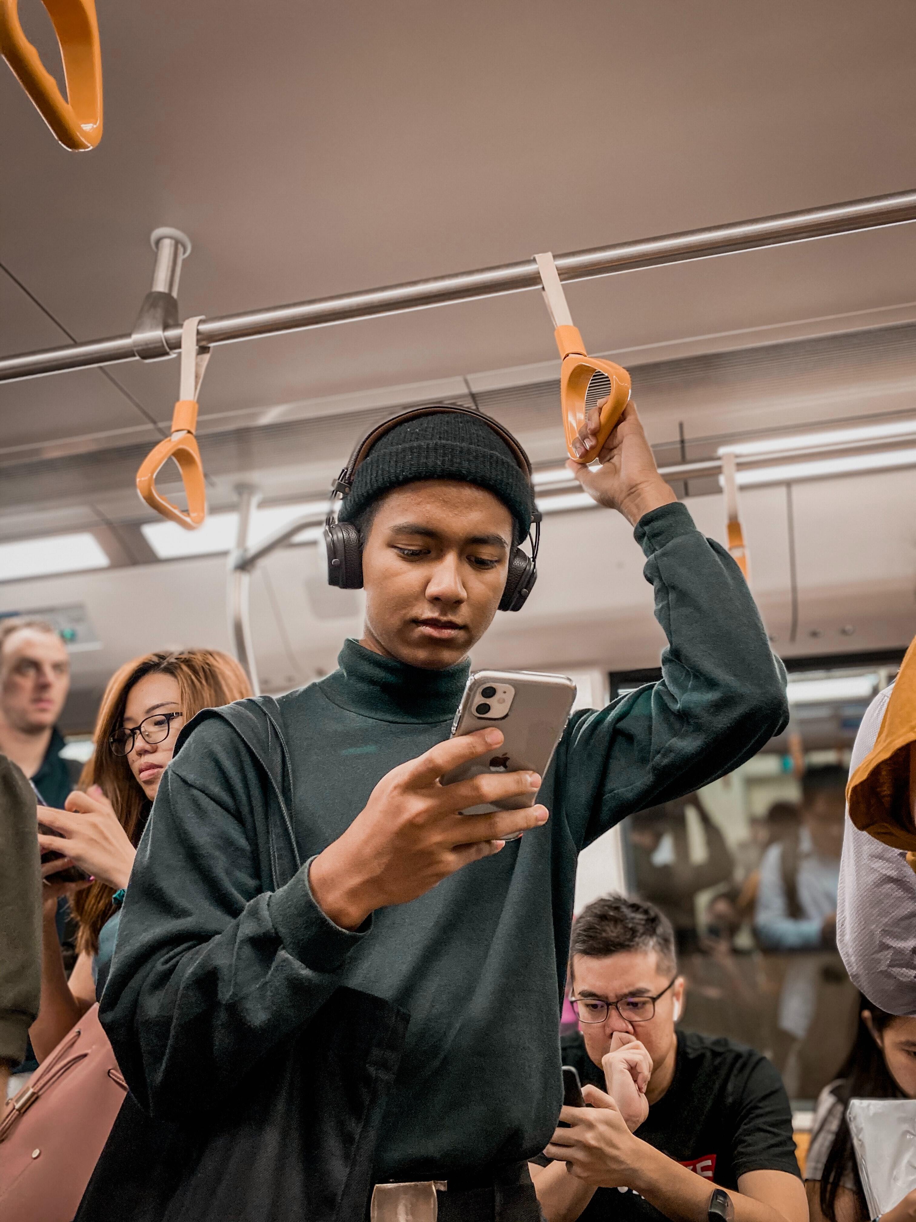 People on their phones in public transport