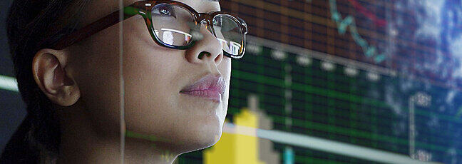 Girl watching a screen with stats