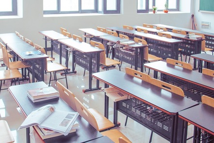 A classroom full of desks and chairs but no people at the moment