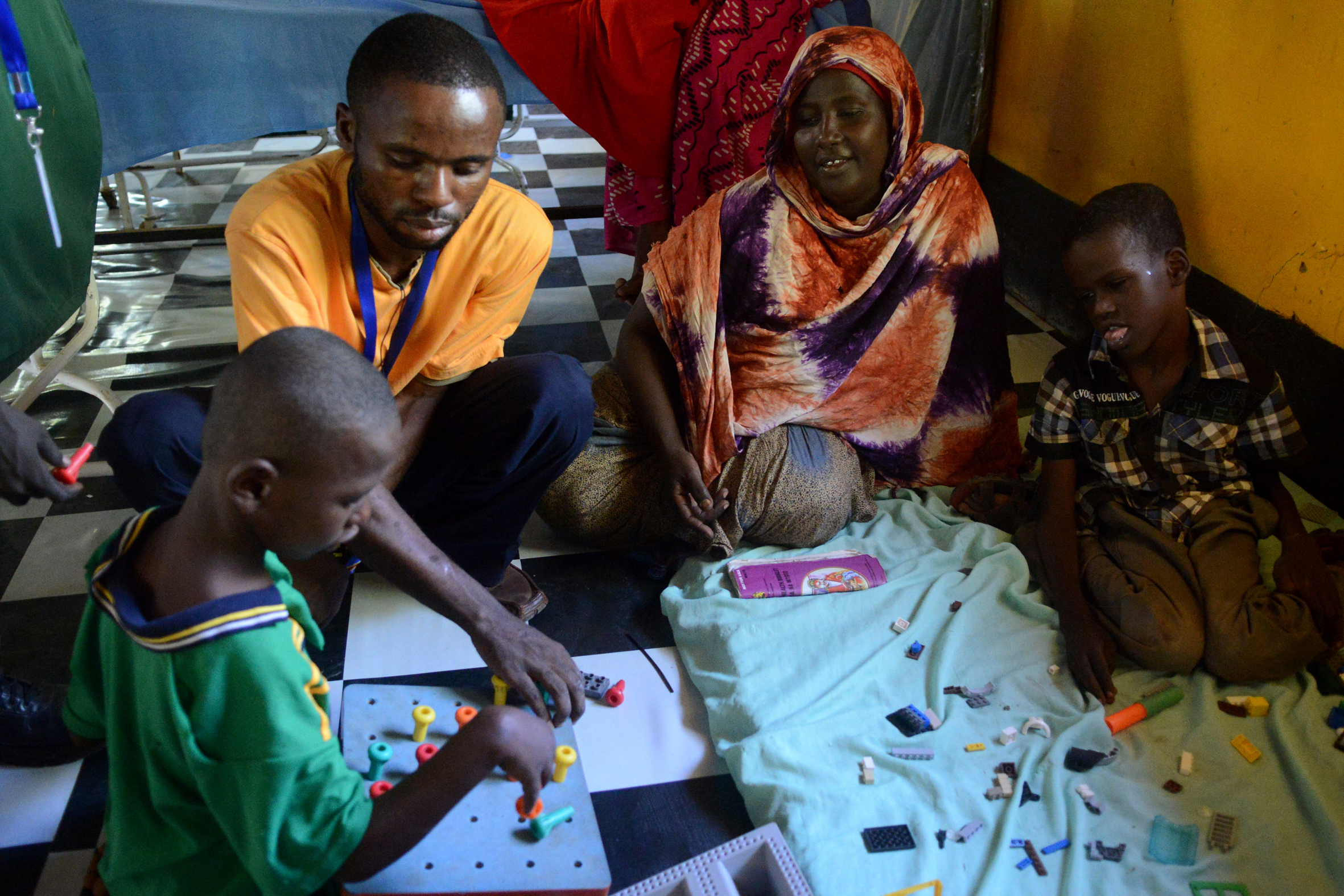 Rehabilitation and occupational therapy exercises for children with disabilities in rehabilitation center in Kakuma, with the support of Handicap International, Kenya, June 2015