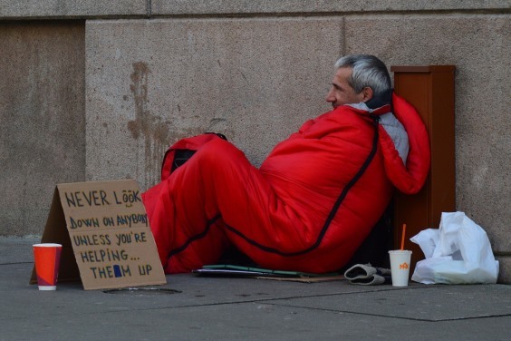 Homeless man in sleeping bag