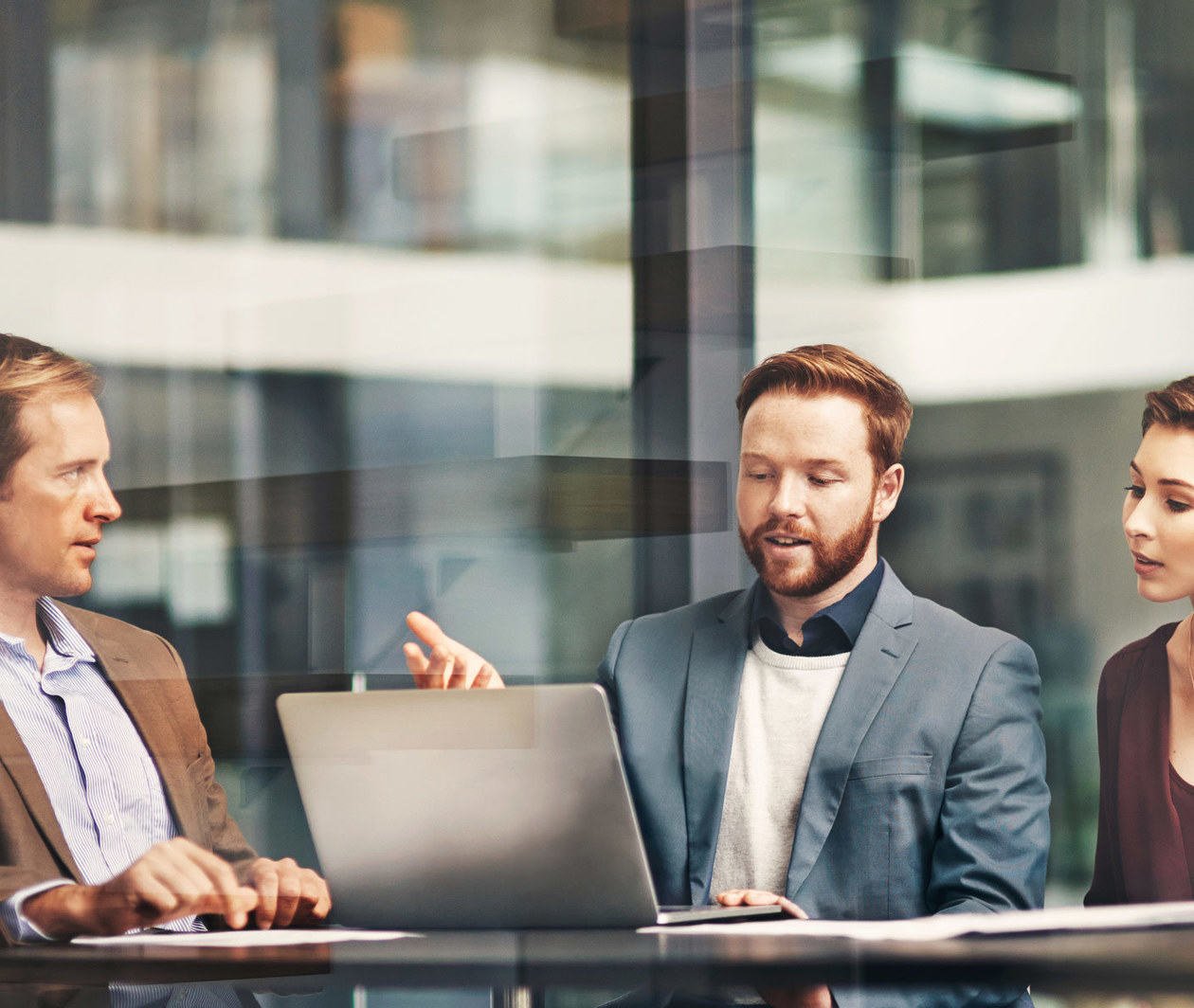 a group of colleagues having a meeting at work