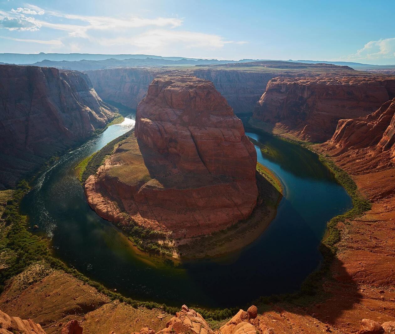 Horseshoe Bend, Arizona. a large horseshoe-shaped bend in the Colorado. The bend encircles a large rock formation that has stood the test of time. River