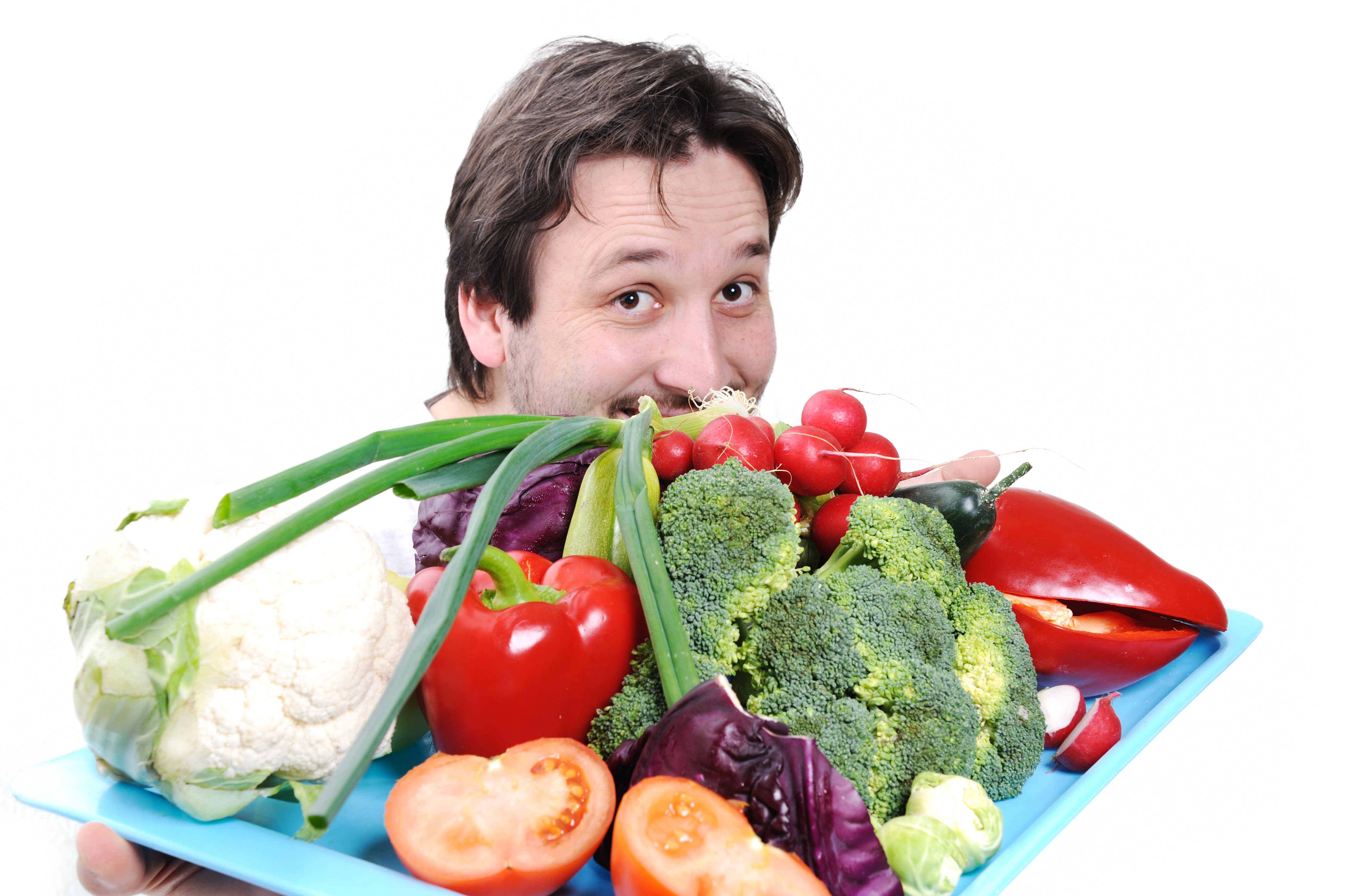 Man holding plate of fruit and vegetables