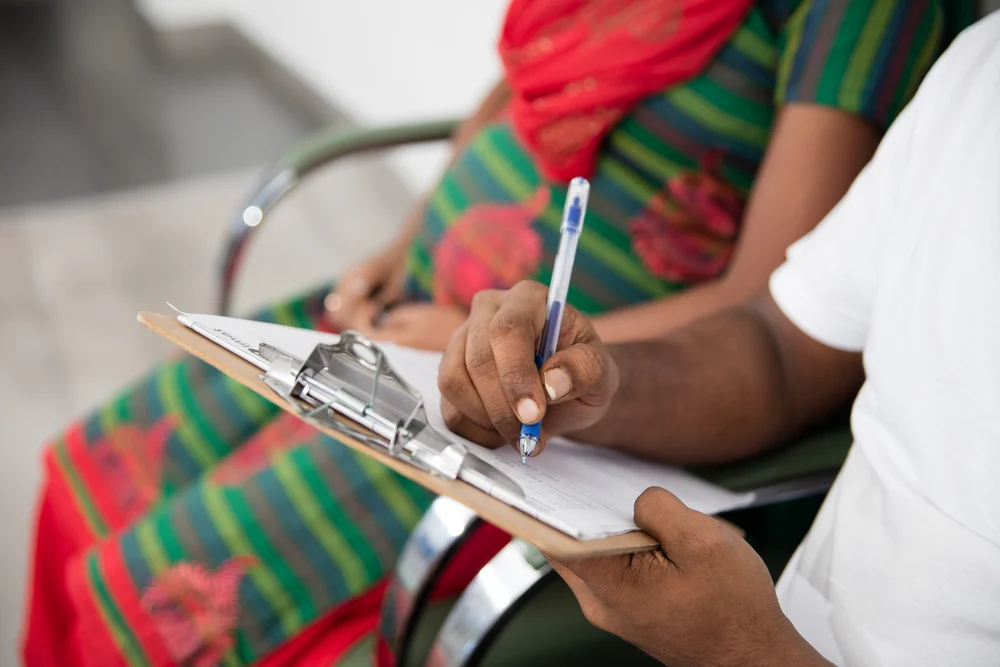 Hindu couple sitting in a waiting room