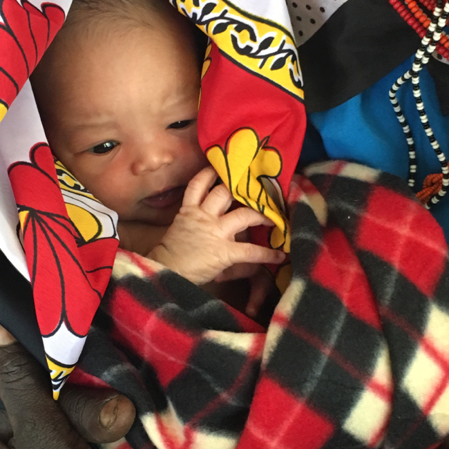 A new born baby wrapped in blankets at a hospital in Laikipia, Kenya.