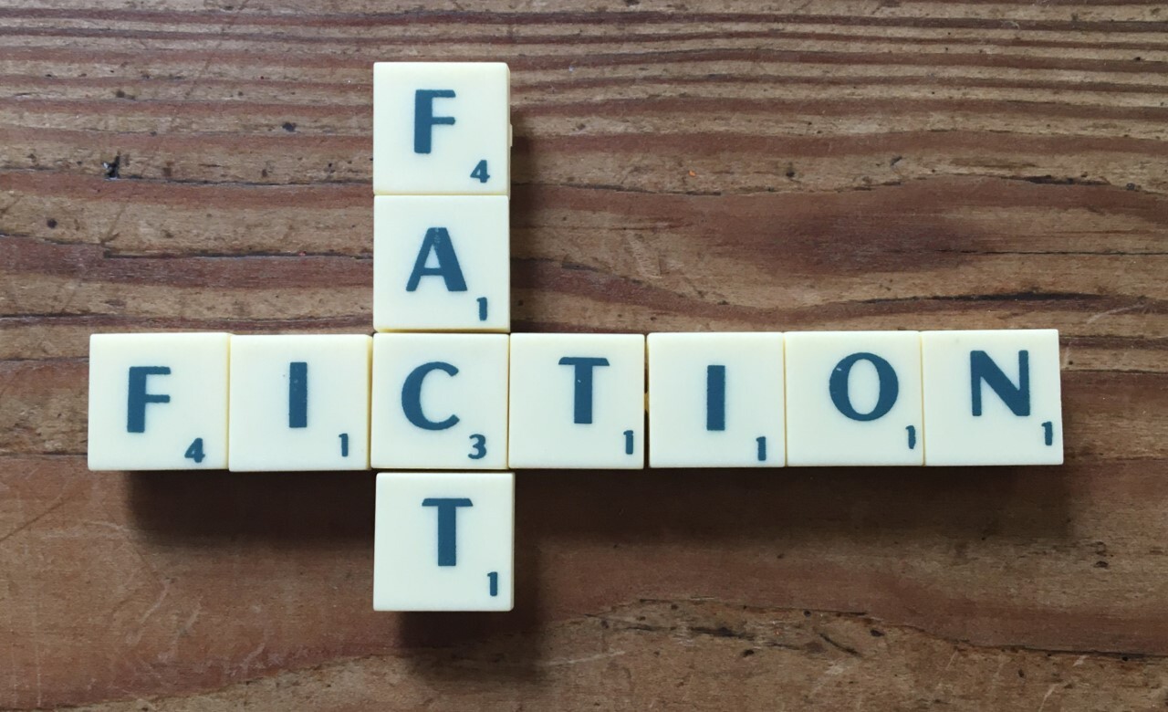 Fact and Fiction intersecting and spelled out in scrabble letters