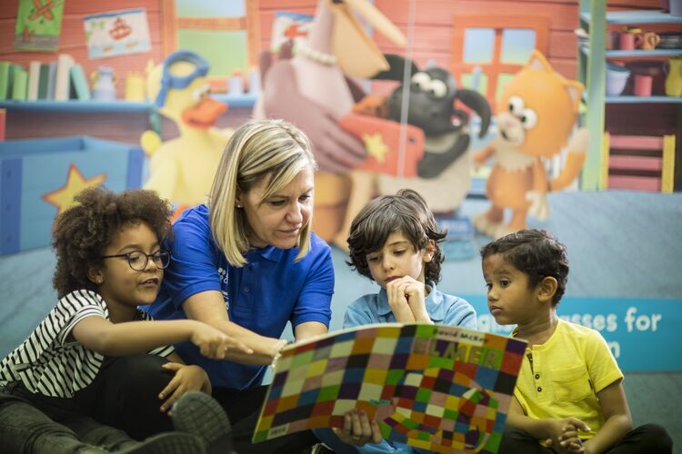 Teacher reading with children