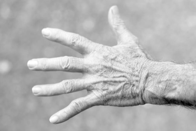 An elderly person's hand
