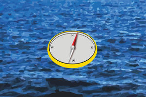 Compass in blue water 