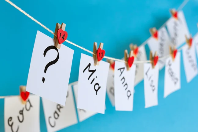 cards with names pegged to a washing line