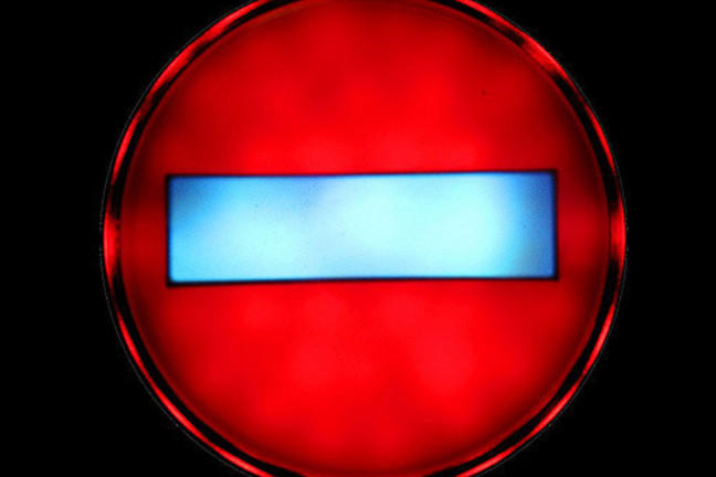 Red circular light with blue bar in the centre: illuminated stop sign