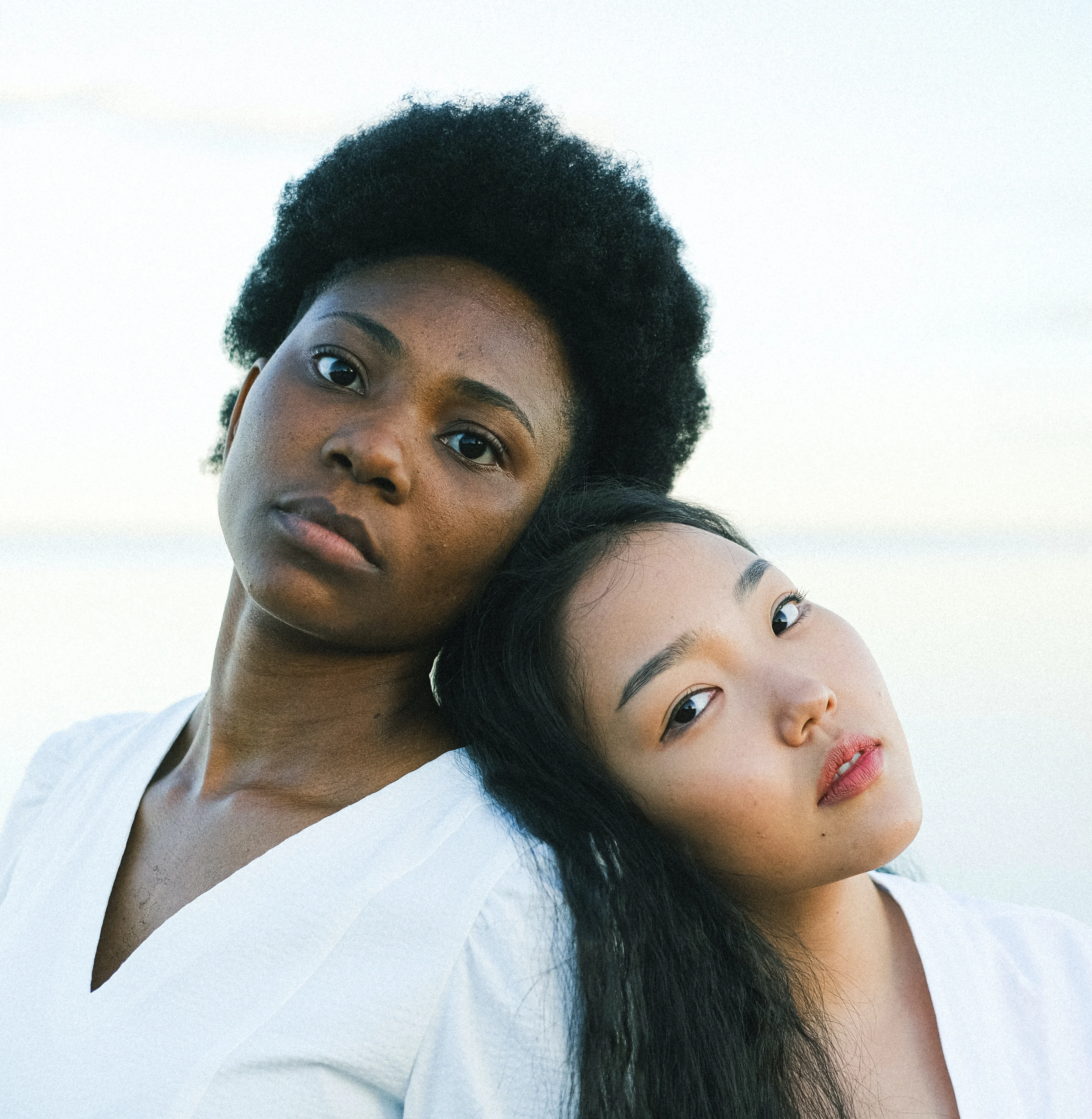 A woman leaning on a friend's shoulder