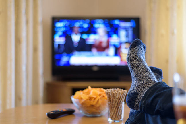 Feet on coffee table.