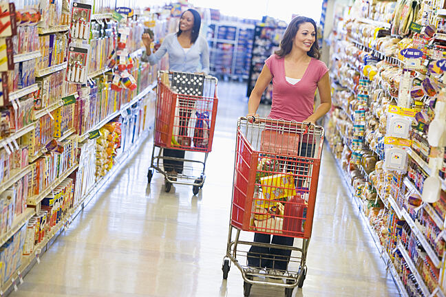 Women grocery shopping in supermarket