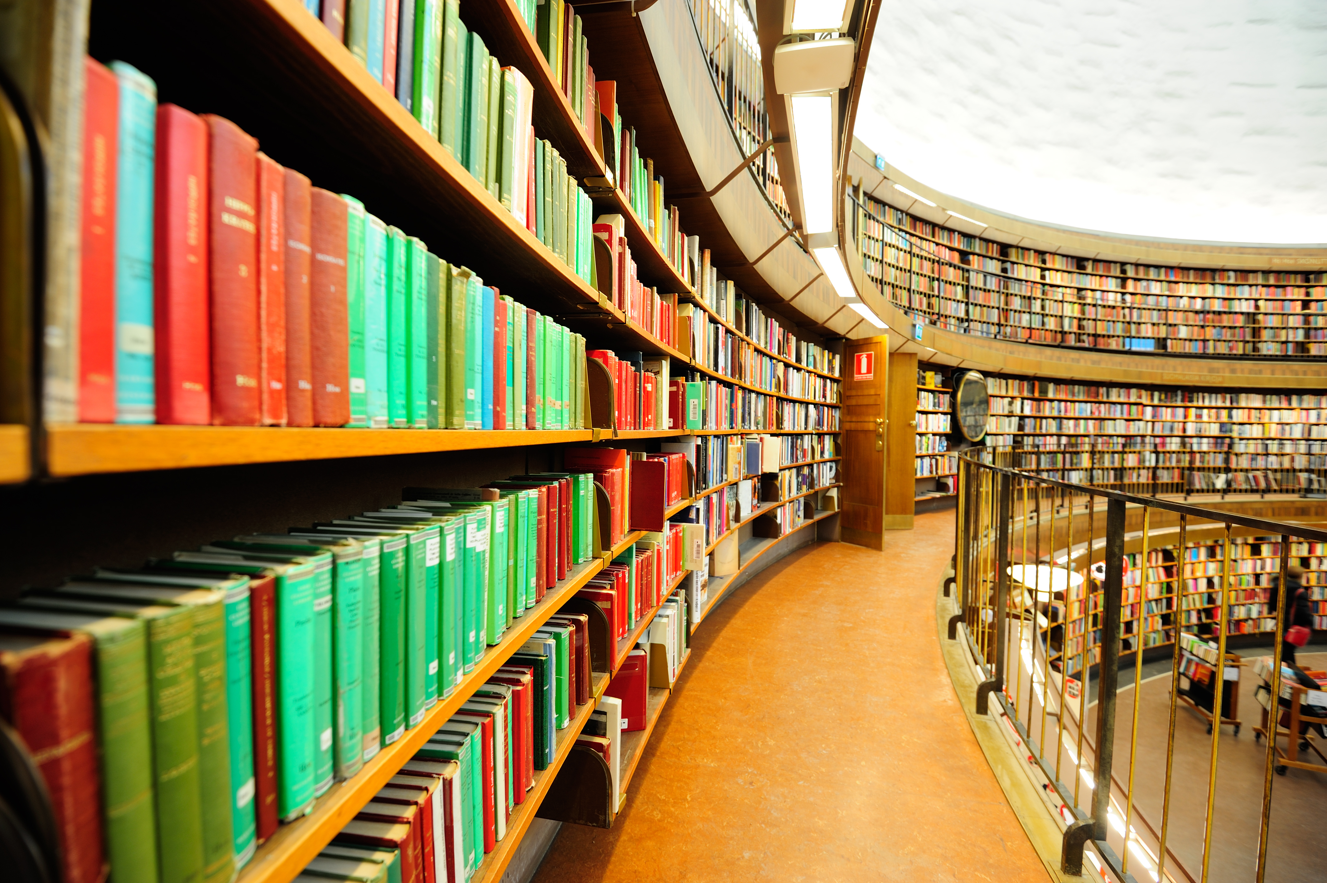 Curved shelves of library books