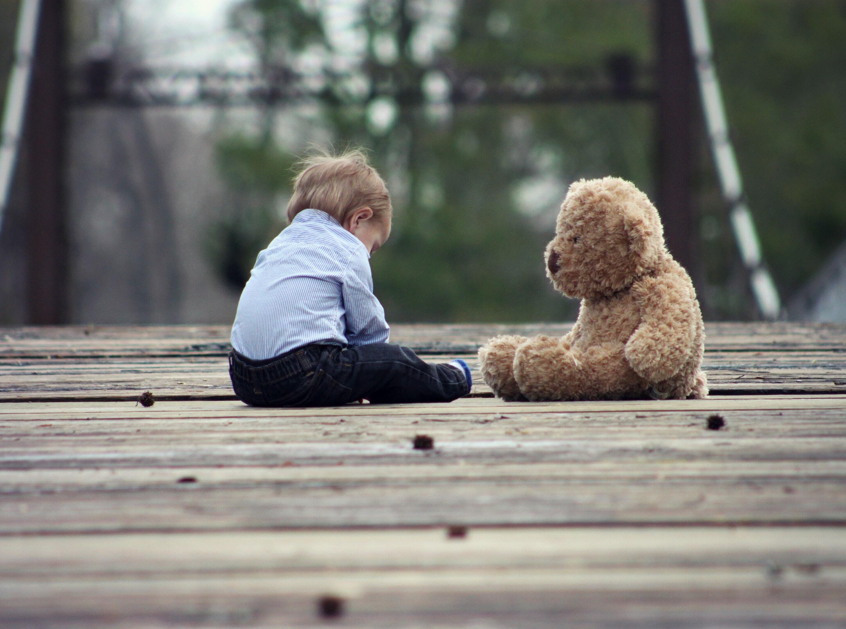 a boy and his teddy bear