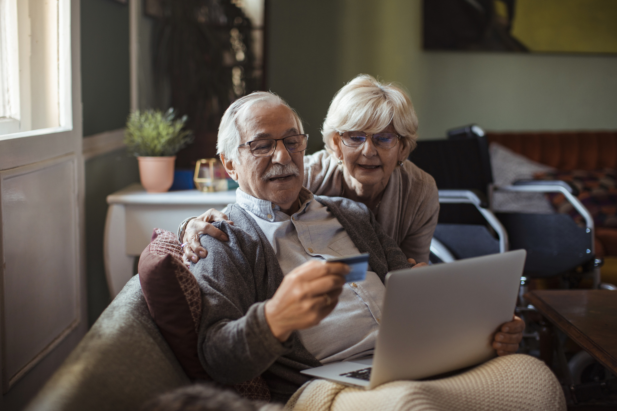 A couple browsing the internet and shopping online.