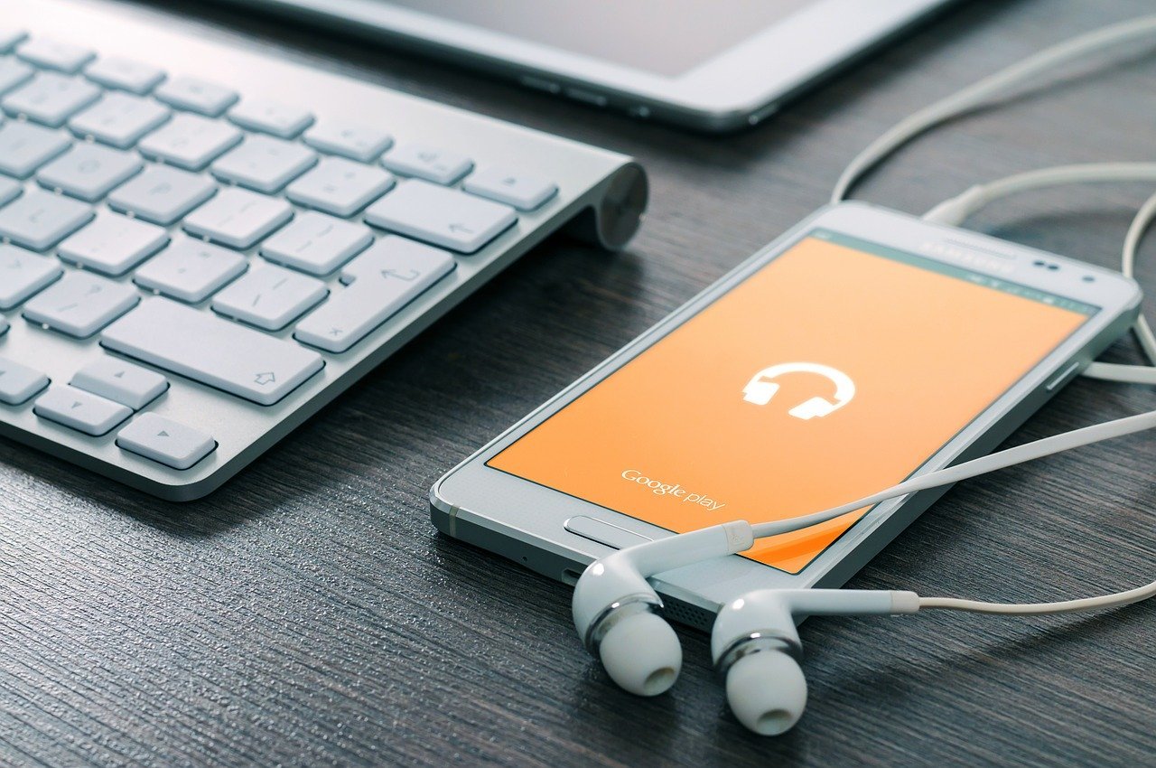 Smartphone, keyboard and earbuds