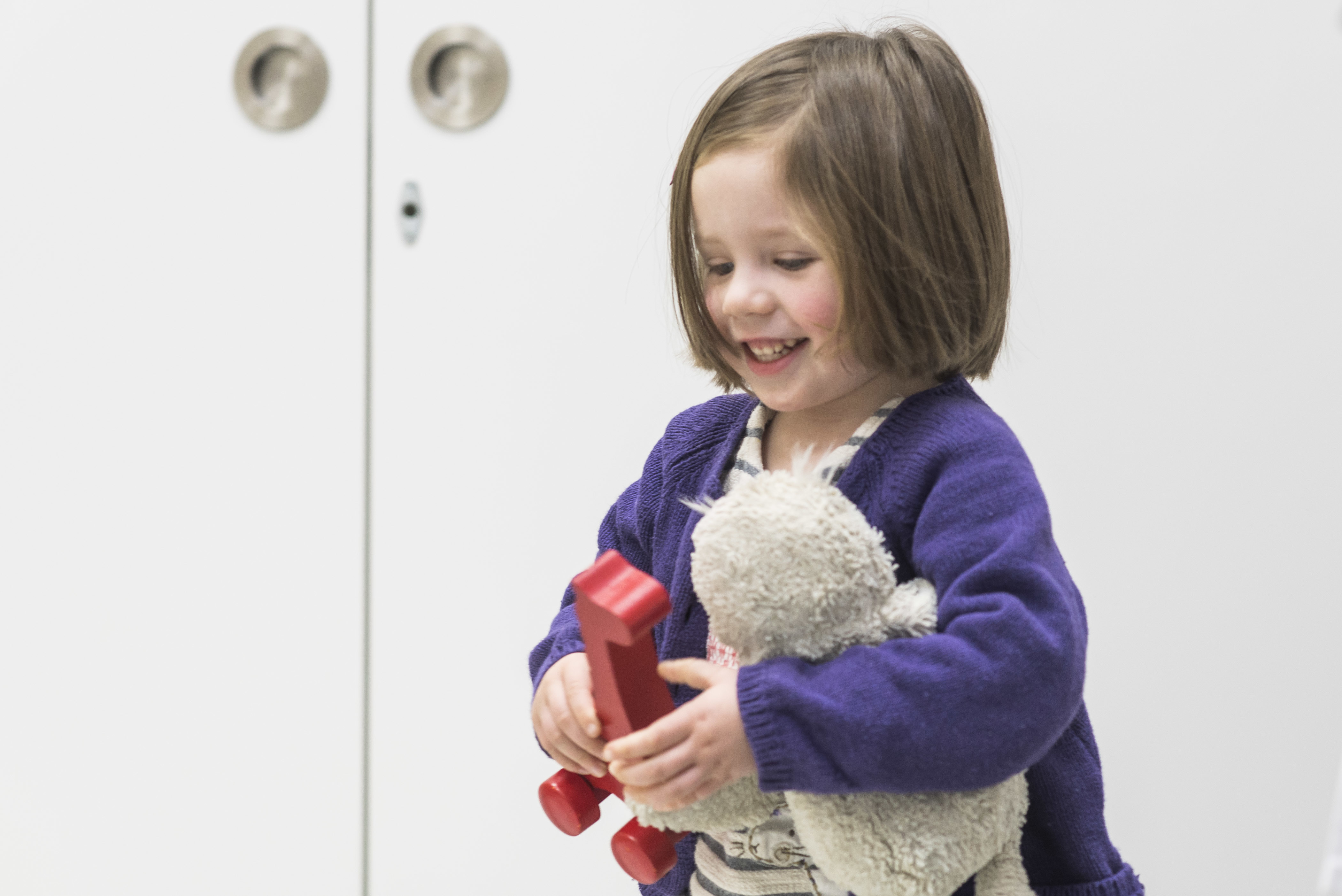 Toddler playing with toys