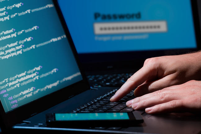 A person trying to gain information on a computer.